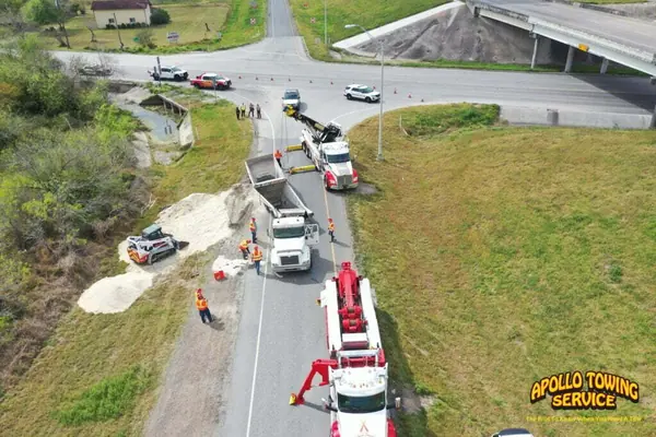 Apollo Towing commercial recovery operation near a highway