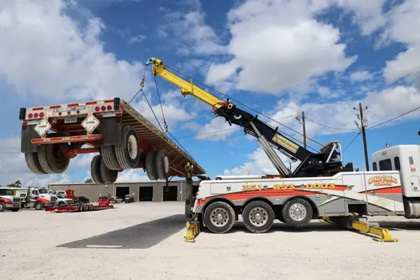 Apollo Towing rotator lifting a commercial trailer